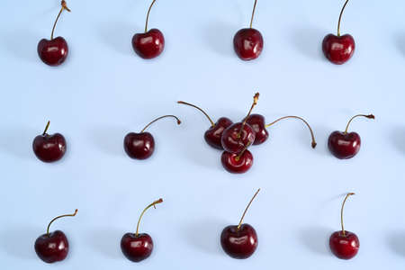 Fresh ripe red cherry on blue background.の写真素材