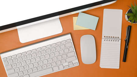 Mock up computer, notebook an sticky notes on brown leather.の写真素材