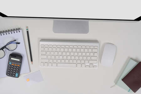 Mock up computer, notebook an sticky notes on brown leather.の写真素材