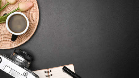 Top view coffee cup, houseplant and wireless keyboard on wooden desk.の写真素材