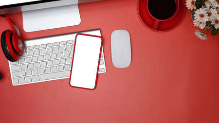 Top view mock up smart phone with white screen on modern workplace.の写真素材
