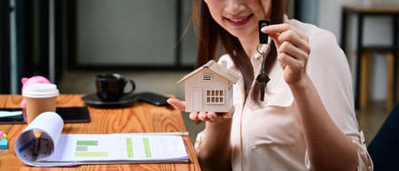 Women using calculator and planing business investment for real estate in the future.の写真素材