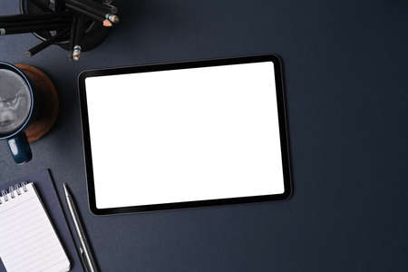 Top view, digital tablet and smart watch on black leather.の写真素材