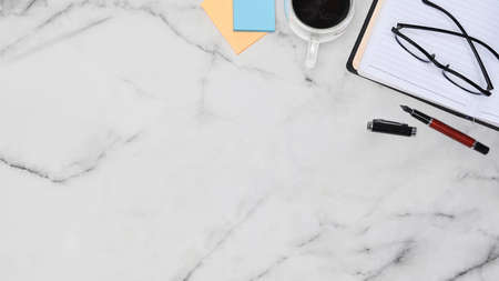 View over businessman shoulder using computer laptop in office.の写真素材