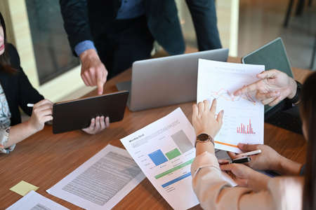 Group of business people discussing new project or startup idea together in meeting room.の写真素材