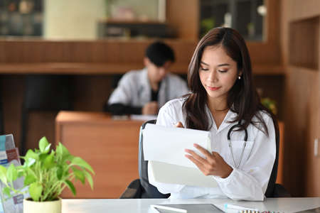 Cropped shot doctor giving a consultation to a patient and explaining medical informations and diagnosis.の写真素材