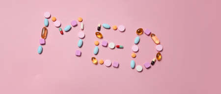 Medical pills on pink background. Medical health care concept.の写真素材