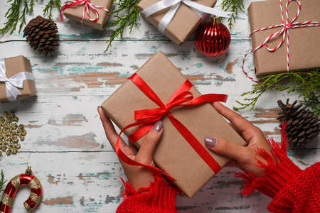 Christmas gift boxes with Christmas ornaments decorations on wooden background.の写真素材