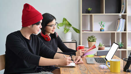 Young creative people working on new startup project in office.の写真素材