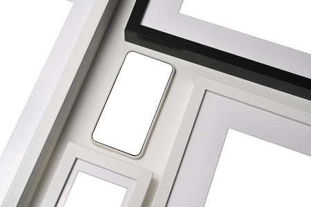Mock up smart phone with empty display and picture frame on white background.の写真素材