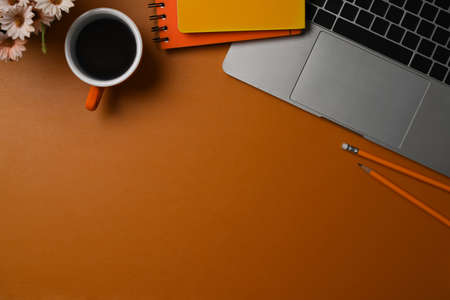 Top view cup of laptop computer, coffee and notebook on brow leather.の写真素材