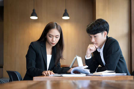 Two business people discussing the strategy plan together.の写真素材