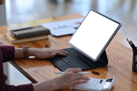 Charming businesswoman working in modern workplace.の写真素材