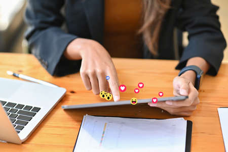 Woman watching video live streamings on her smartphone. Social media and digital online concept.