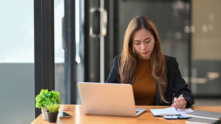 Young woman entrepreneur working with laptop computer.の写真素材