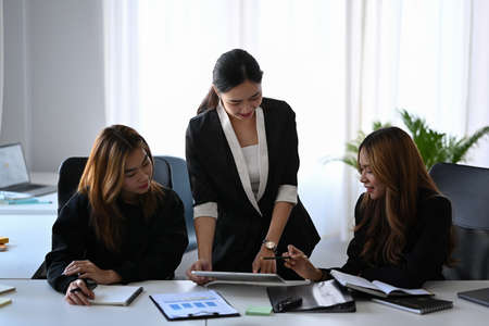 Group of young business people working on new project together in modern office.の写真素材