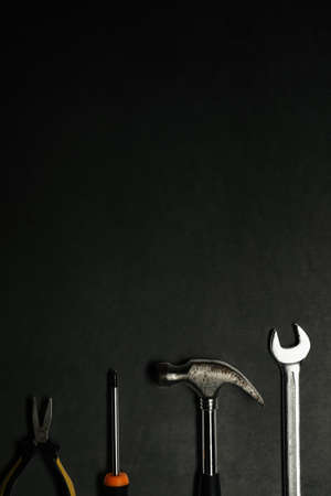 Flat lay construction tools on black background with copy space.の写真素材