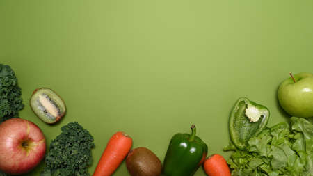 Fresh vegetables on green background with copy space. Healthy food concept.の写真素材