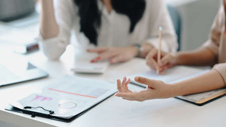 Two business colleagues discussing about project startup ideas together.の写真素材