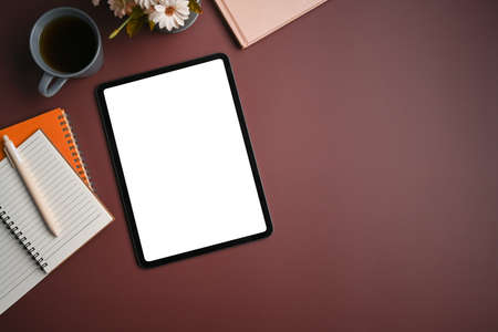 Above view woman hand typing on screen of digital tablet.