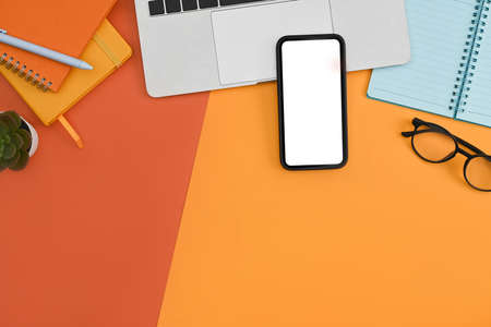Mockup mobile phone, laptop computer, notebook and potted plant on colorful background.