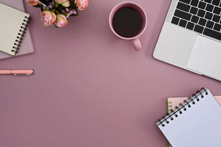 Coffee cup, laptop computer and notebook on purple background. Top view.の写真素材