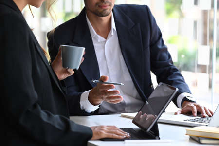 Start up business people discussing project statistics or financial report together.の写真素材