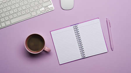 Flat lay empty notebook, coffee cup and pen on purple background.の写真素材