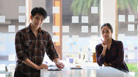 Graphic designers working with UX designer designing framework layout development project for mobile application at modern office.の写真素材