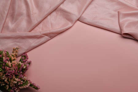 Dried flower bouquet on pink background with copy space for your advertise text. Flat lay, top view.の写真素材