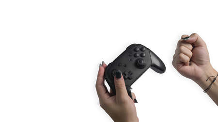 Woman hand holding video game console controller isolated on white background.