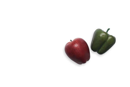 Green organic bell pepper and apple isolated on white background.の写真素材