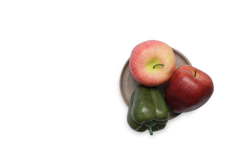Green organic bell pepper and apple isolated on white background.の写真素材