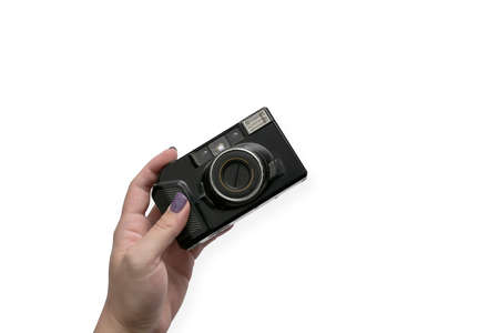 Young woman holding vintage camera isolated on white background with copy space.