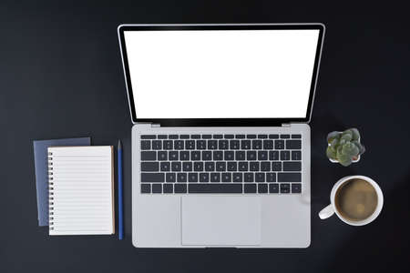 Top view mock up laptop computer with blank screen on black background.の写真素材