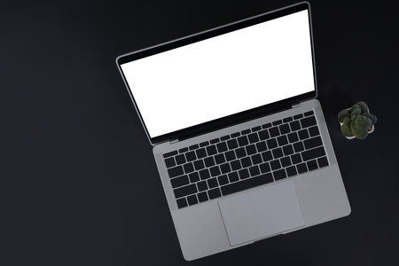 Top view mock up laptop computer with blank screen on black background.の写真素材