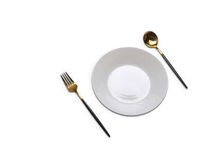 Empty plate with fork and spoon isolated on white background.