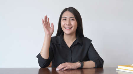 Head shot of attractive young woman making video conference, online distant job interview at home.