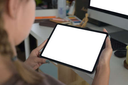 Cropped shot woman hands holding digital tablet with blank screen for your text message or...