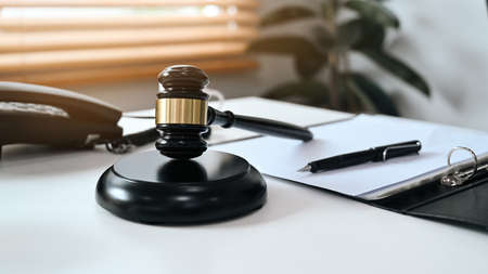 Judge gavel and contract papers putting on white table. Lawyer, justice and law ,attorney, concept.