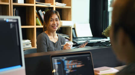 Young software engineers team developing website design and coding technologies in startup company.の写真素材
