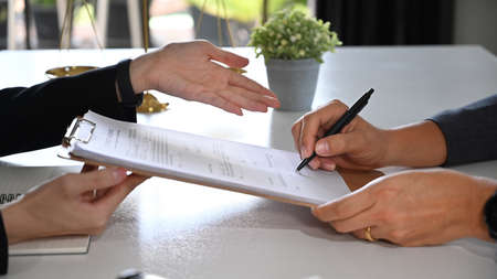 Cropped imaged of female lawyer discussing contract document, providing law consultation and legal...