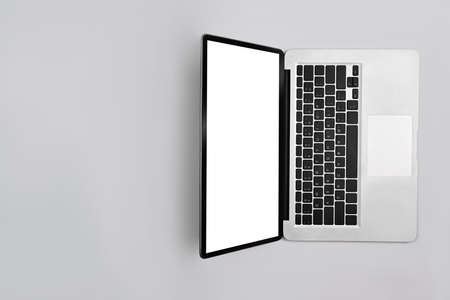 Mock up laptop computer with empty display on white background. Top view with copy space.の写真素材