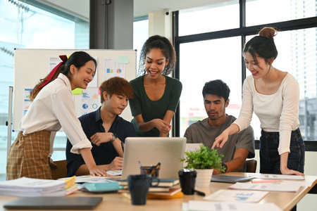 Group of startup business people in dressed casually brainstorming and working on new project at creative office.の写真素材
