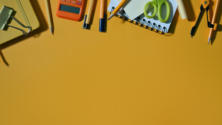 Back to school concept, various school supplies on yellow background. Flat lay, Top view with copy...