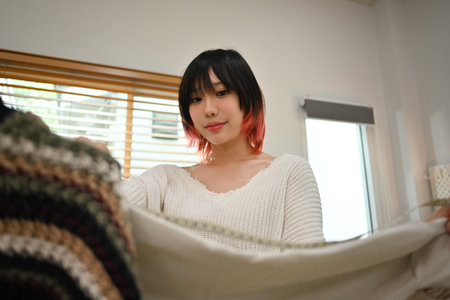 Asian female fashion designers working on new collection at home office. Online seller, business and...