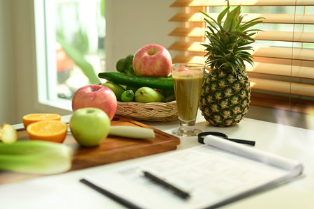 Fruit and vegetable on chopping board with Nutrition Facts on table. High quality photoの写真素材