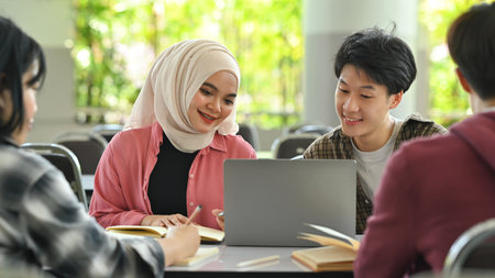 University students collaborating on a project in campus. Education, Learning and technology...
