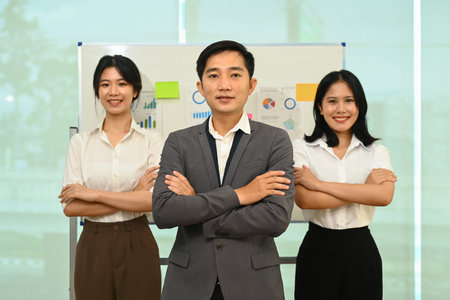 Confident business people or professional standing with arms crosse and smiling to camera.の写真素材