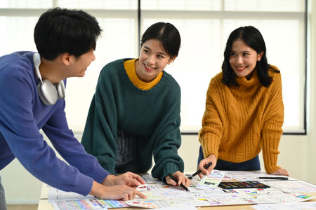 Image of mobile application designers team discussing, brainstorming for new approaches and ideas...